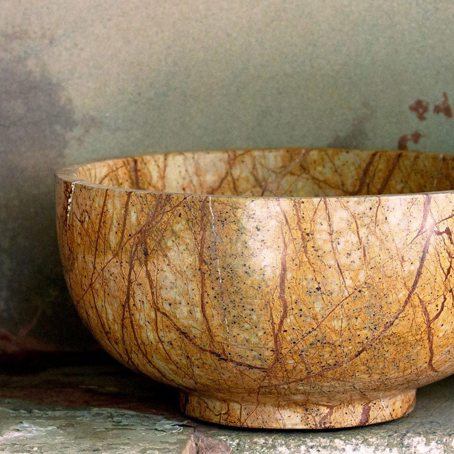 Brown veined stone bowl.
