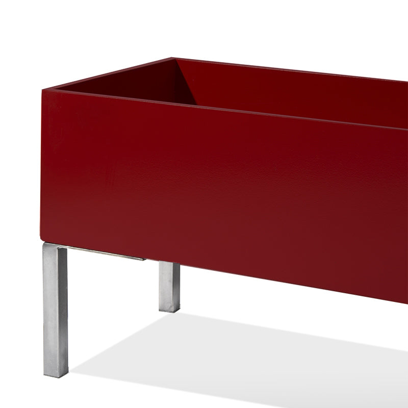 60-inch rectangular indoor planter in satin burgundy with brushed stainless steel legs.
