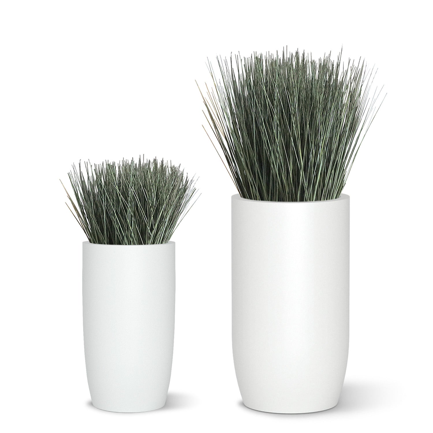 Two botanical designs with cortada grass in white fiberglass barrels.