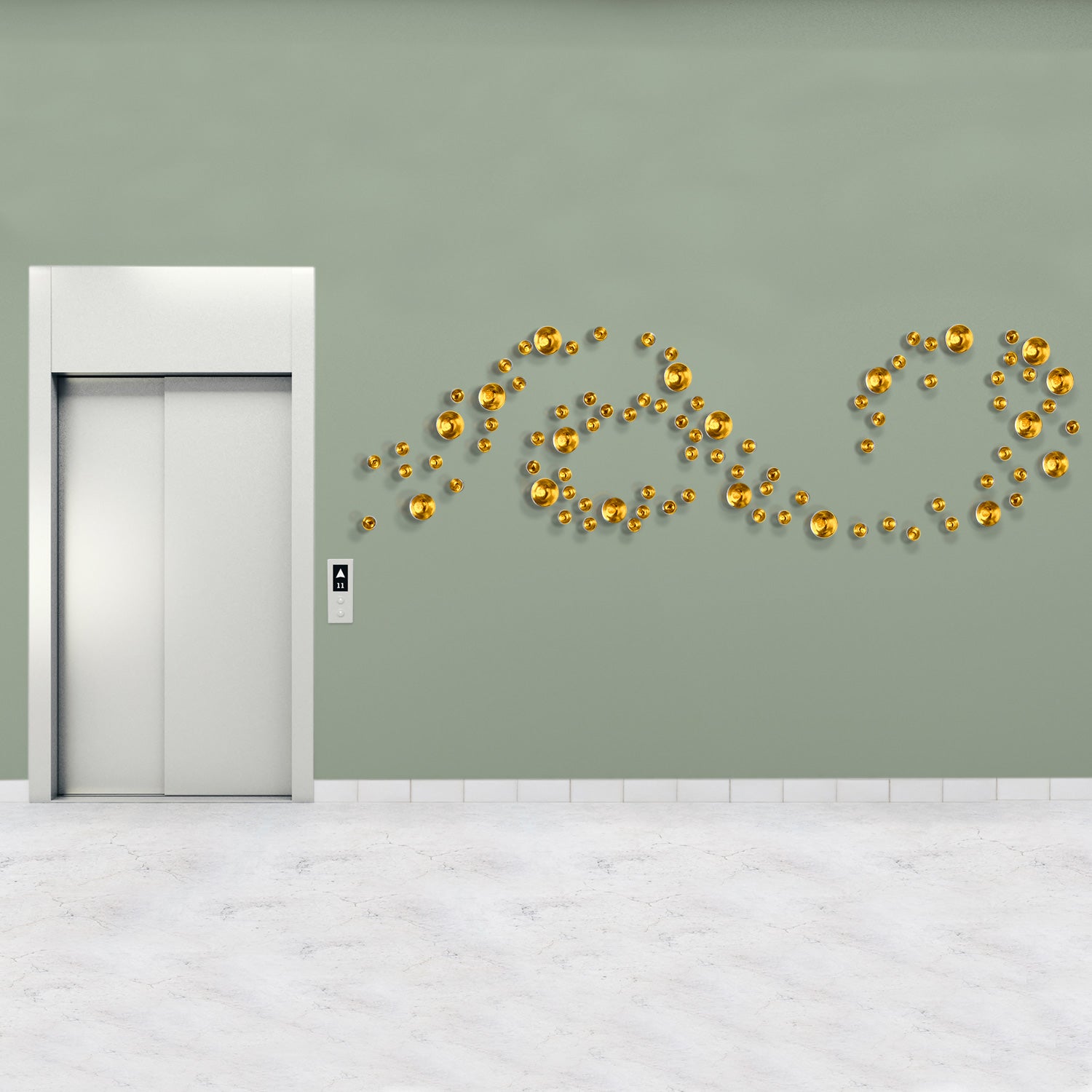 Decorative gold Wall Play on a green wall next to an elevator.