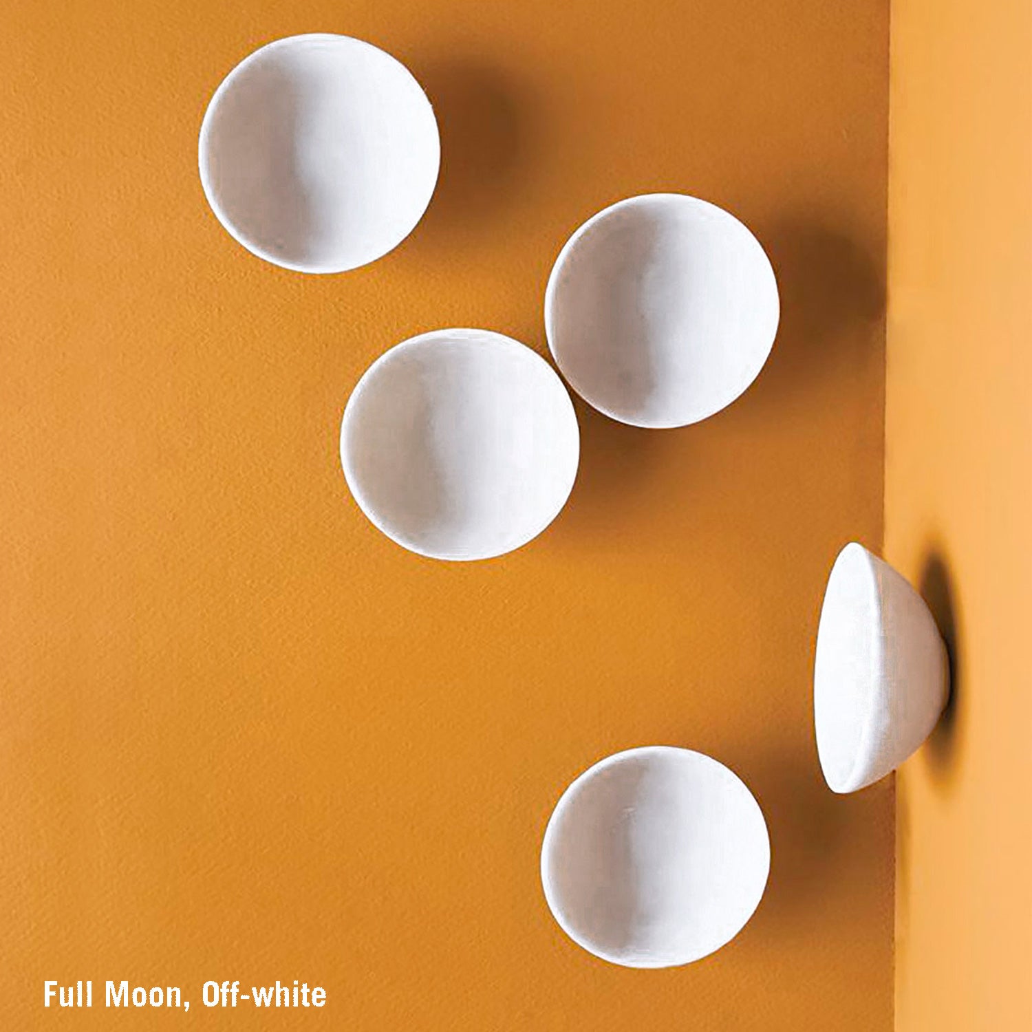 Five white resin Full Moon Wall Play on an orange background