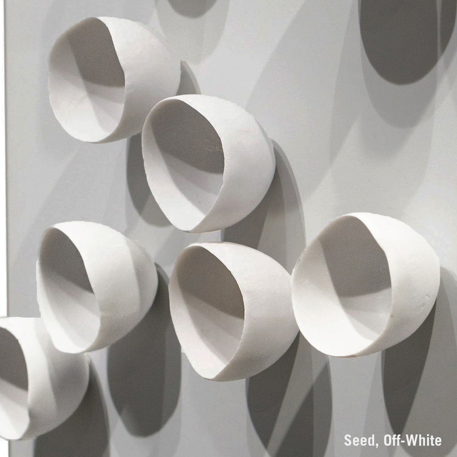 Close-up of a textured wall with Seed Wall Play in off-white color.