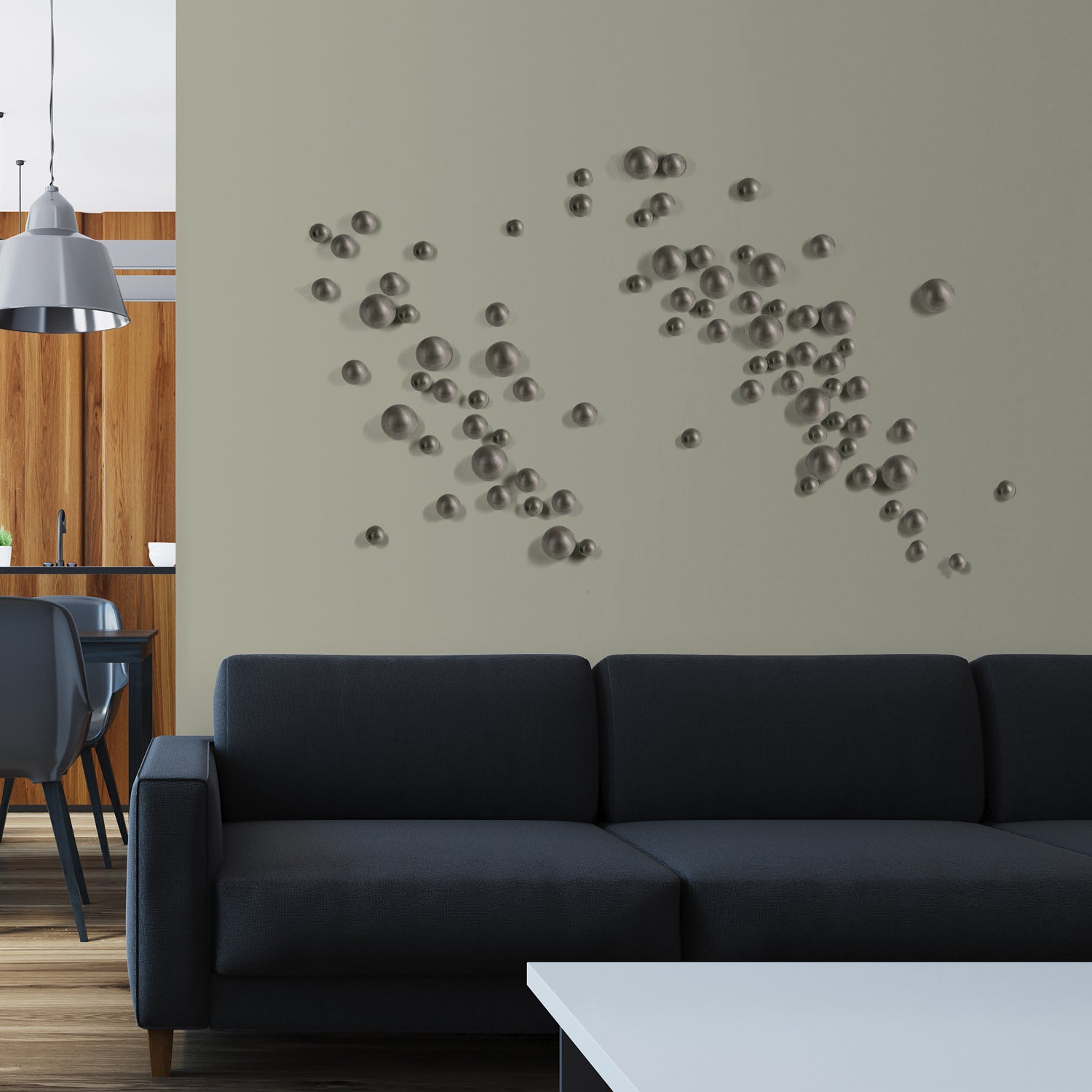 Modern living room with a dark gray sofa and decorative wall art.