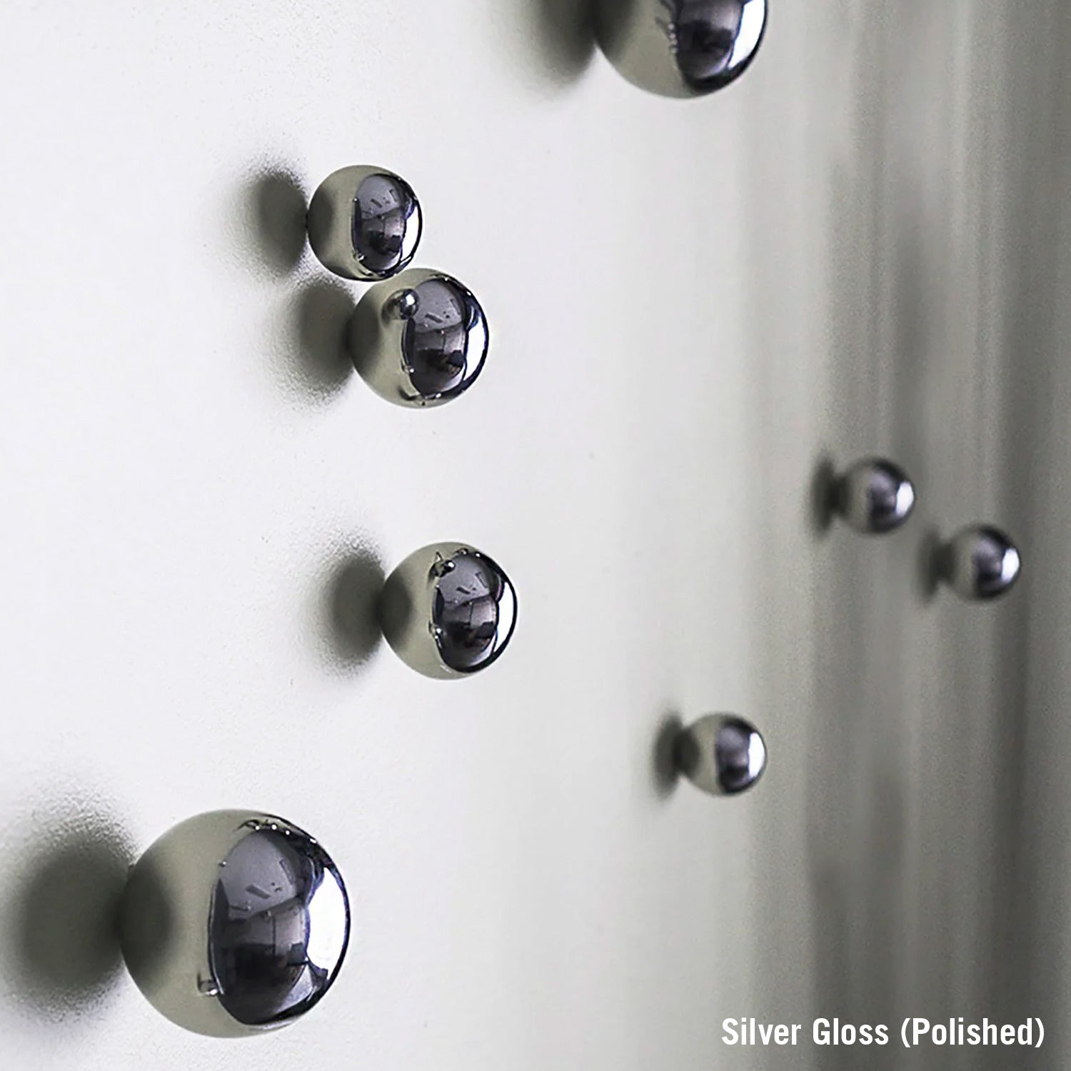 Close-up of silver knobs on a white surface with 'Silver Gloss (Polished)' text.
