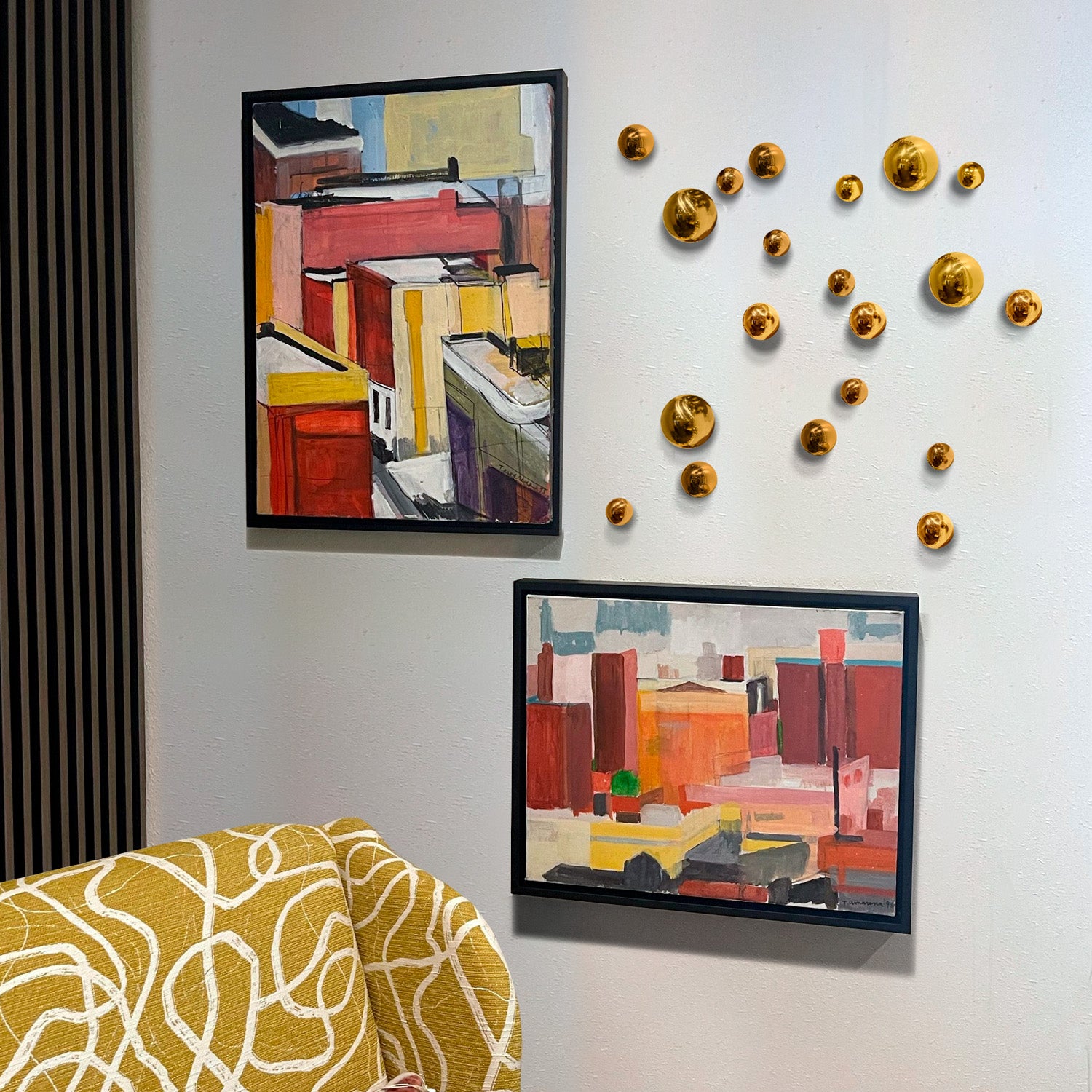 Mica Orb Wall Play on a wall with artwork in a living room setting.