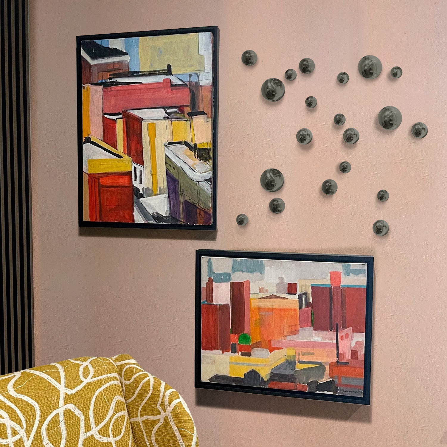 Mica Orb Wall Play on a wall with artwork in a living room setting.