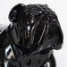 Close up of the face of a large black bulldog fiberglass sculpture.